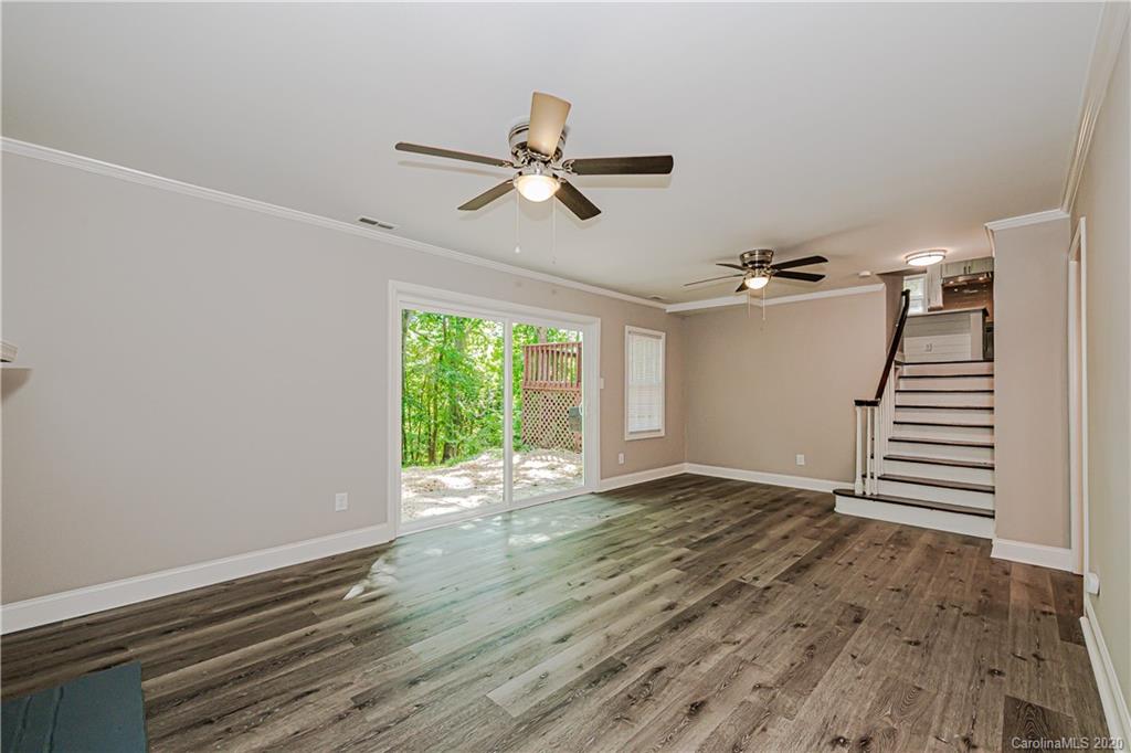 7415 Watercrest Road Charlotte, NC 28210 - Photo 21 of 35 wooden floor in an empty room with a window