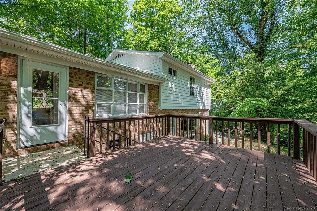 7415 Watercrest Road Charlotte, NC 28210 - Photo 29 of 35 a balcony with wooden floor table and chairs