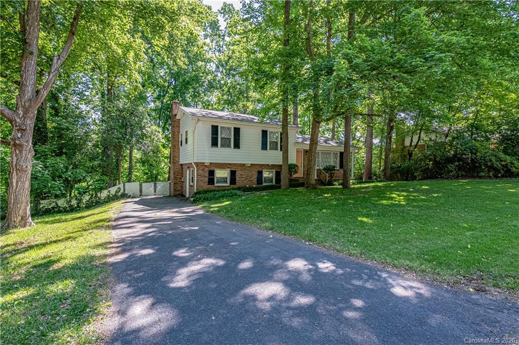 7415 Watercrest Road Charlotte, NC 28210 - Photo 33 of 35 a front view of a house with a yard and tree