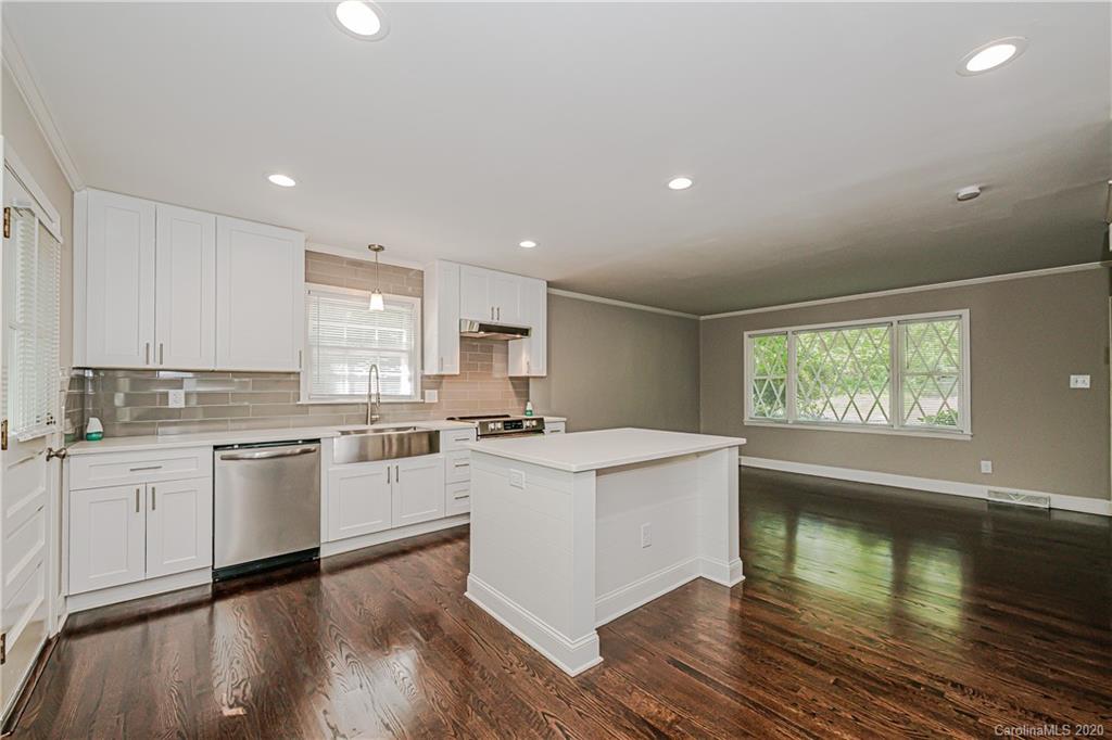 7415 Watercrest Road Charlotte, NC 28210 - Photo 6 of 35 a kitchen with a stove sink and cabinets