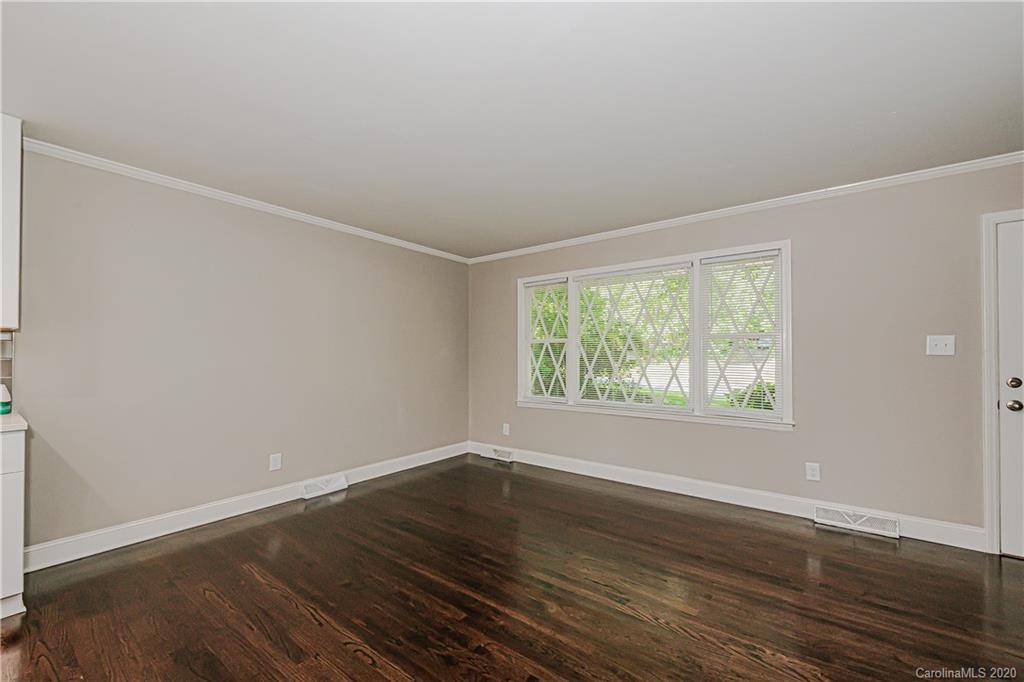 7415 Watercrest Road Charlotte, NC 28210 - Photo 10 of 35 an empty room with wooden floor and windows