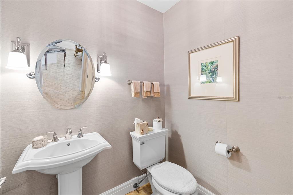 162 Blackwall Court Boca Grande, FL 33921 - Photo 16 of 62 a bathroom with a toilet a sink and mirror
