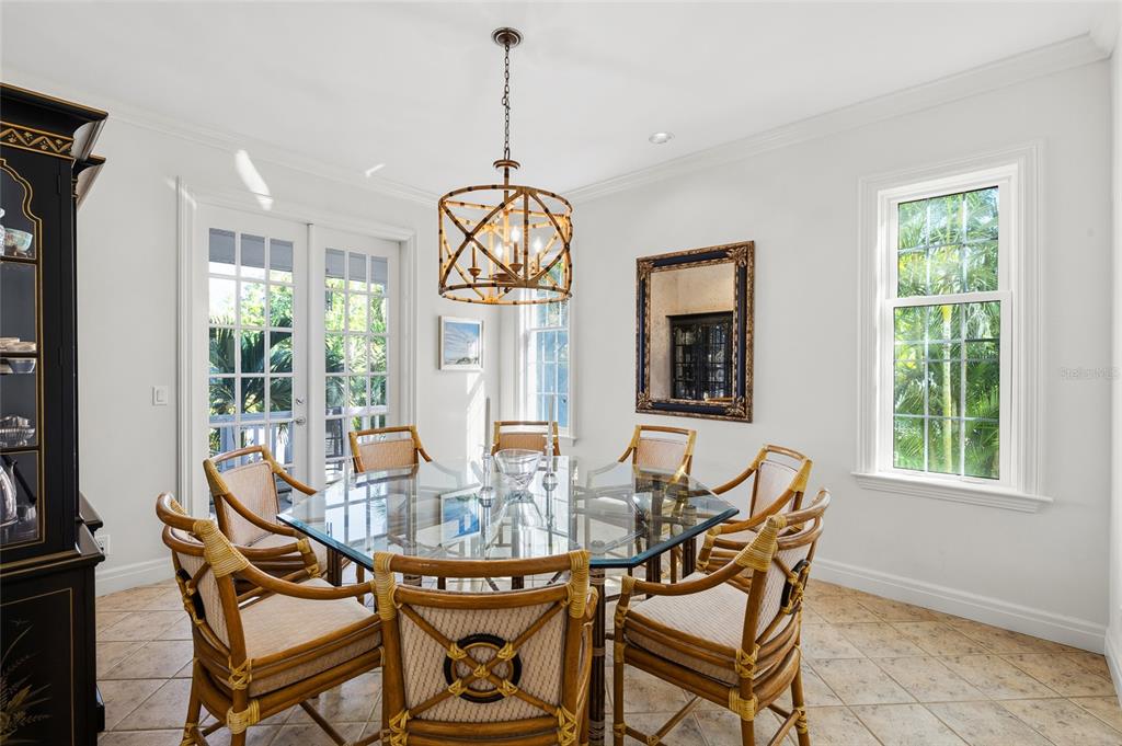162 Blackwall Court Boca Grande, FL 33921 - Photo 18 of 62 a dining room with furniture a livingroom and wooden floor
