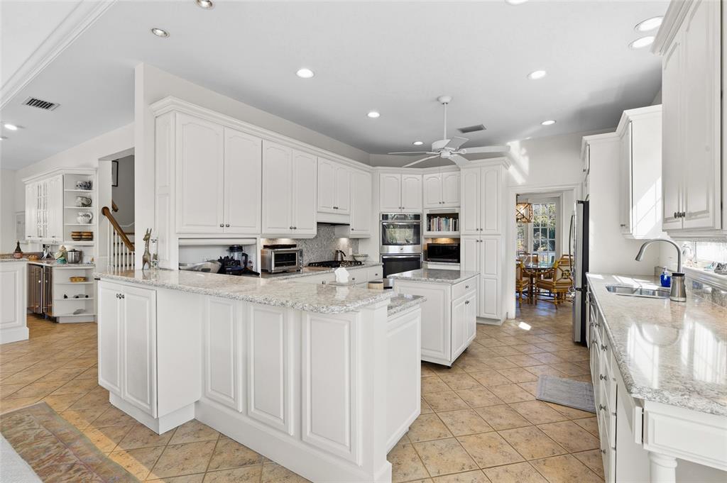 162 Blackwall Court Boca Grande, FL 33921 - Photo 20 of 62 a kitchen with stainless steel appliances a refrigerator sink and cabinets