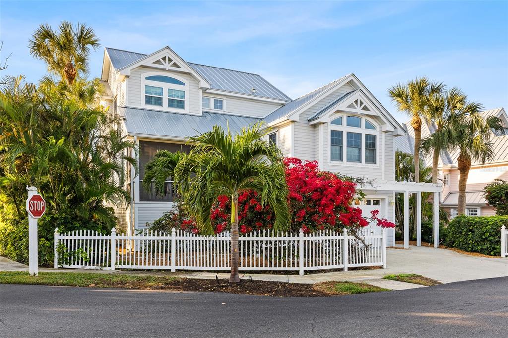 162 Blackwall Court Boca Grande, FL 33921 - Photo 2 of 62 a front view of a house with a garden