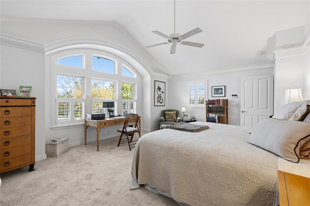 162 Blackwall Court Boca Grande, FL 33921 - Photo 30 of 62 a bedroom with a bed and a chandelier