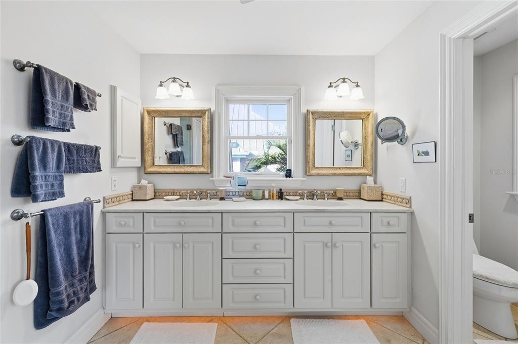 162 Blackwall Court Boca Grande, FL 33921 - Photo 32 of 62 a bathroom with a sink a mirror and a toilet
