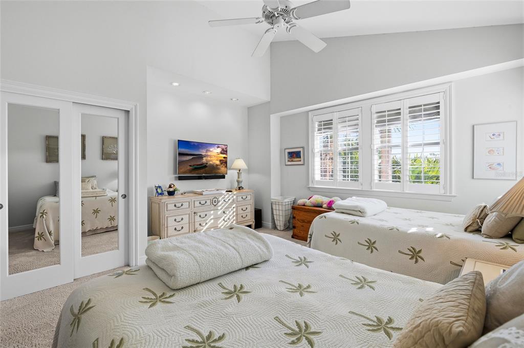 162 Blackwall Court Boca Grande, FL 33921 - Photo 35 of 62 a bedroom with a large bed and a flat screen tv