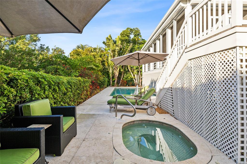 162 Blackwall Court Boca Grande, FL 33921 - Photo 42 of 62 a small pool with a table and chairs