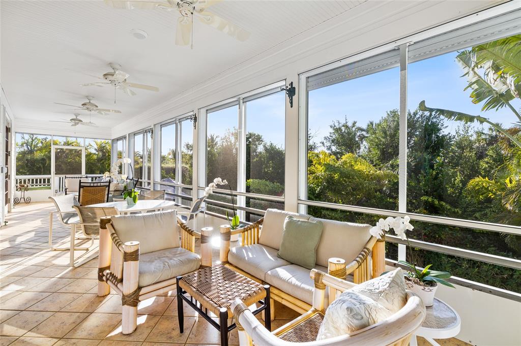 162 Blackwall Court Boca Grande, FL 33921 - Photo 5 of 62 a living room with patio furniture and a floor to ceiling window