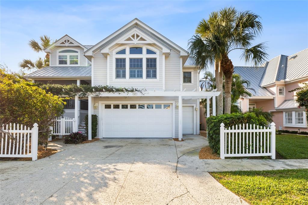 162 Blackwall Court Boca Grande, FL 33921 - Photo 56 of 62 a front view of a house with a garden