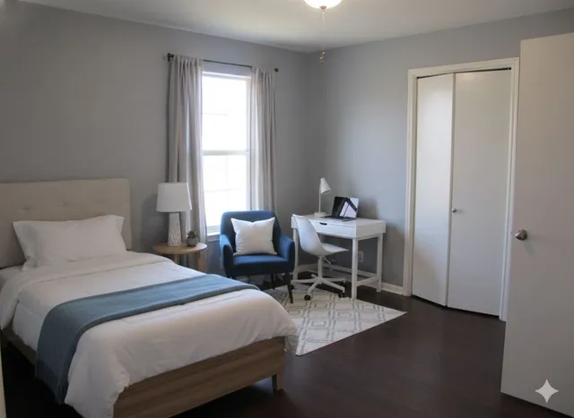 a bedroom with a bed and a windows