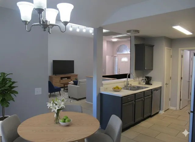 a en suite bathroom with a double vanity sink and a mirror