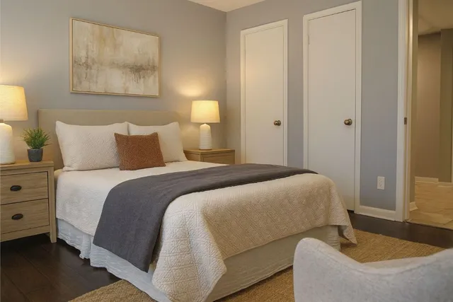 a bedroom with a bed and couch