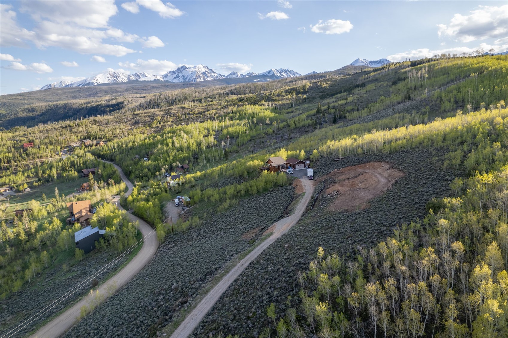 1116 Blue Ridge Road Silverthorne, CO 80498 - Photo 8 of 9 Drone / aerial view of a heavily wooded area and a mountain backdrop