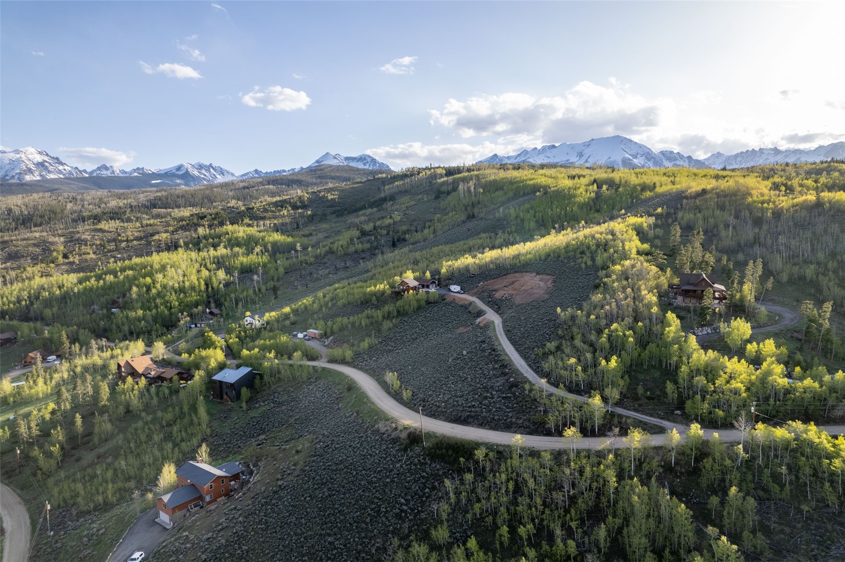 1116 Blue Ridge Road Silverthorne, CO 80498 - Photo 9 of 9 Aerial view of a heavily wooded area and a mountain backdrop