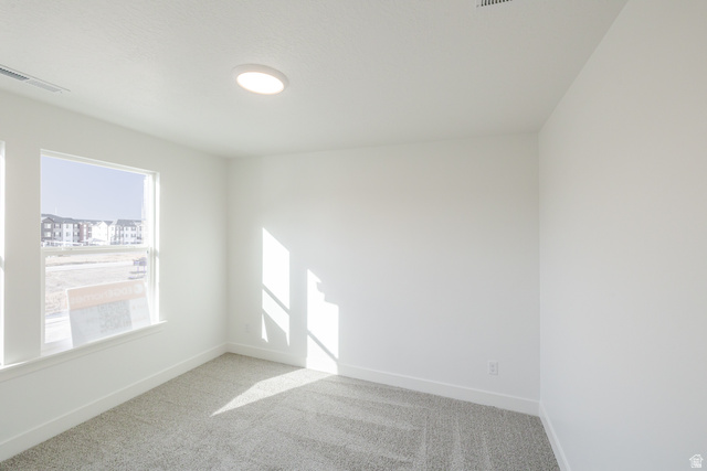 4775 Olive Avenue, Unit 412 Mapleton, UT 84664 - Photo 15 of 19 Spare room with light carpet and baseboards