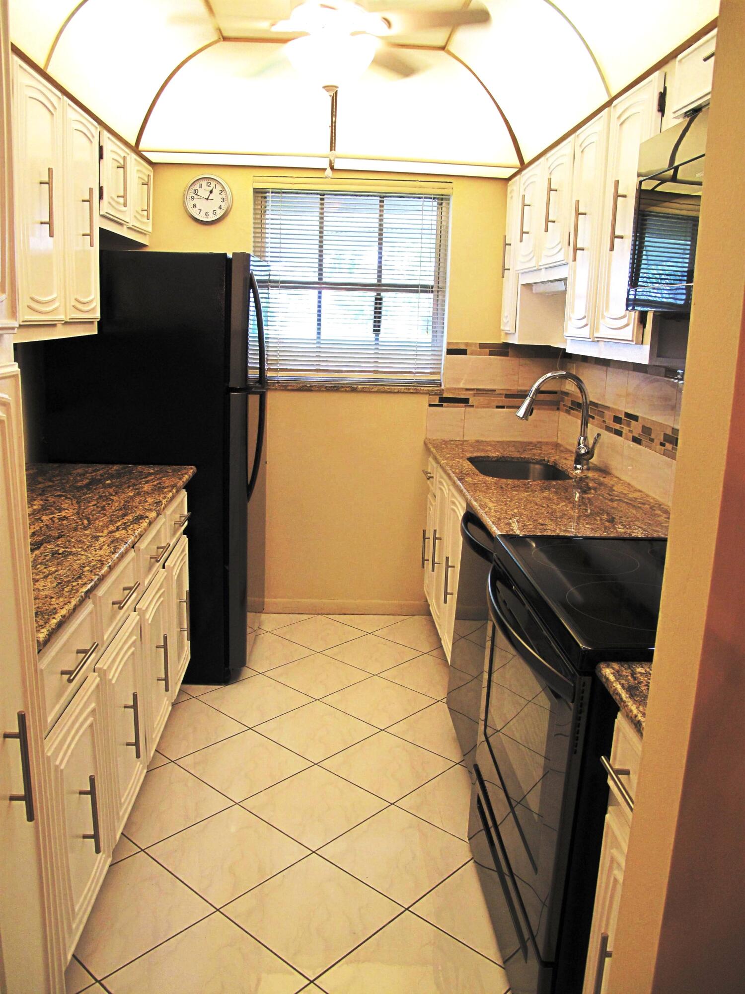 1202 South Drive Circle, Unit B Delray Beach, FL 33445 - Photo 14 of 57 New Black SS appliances with new garnite