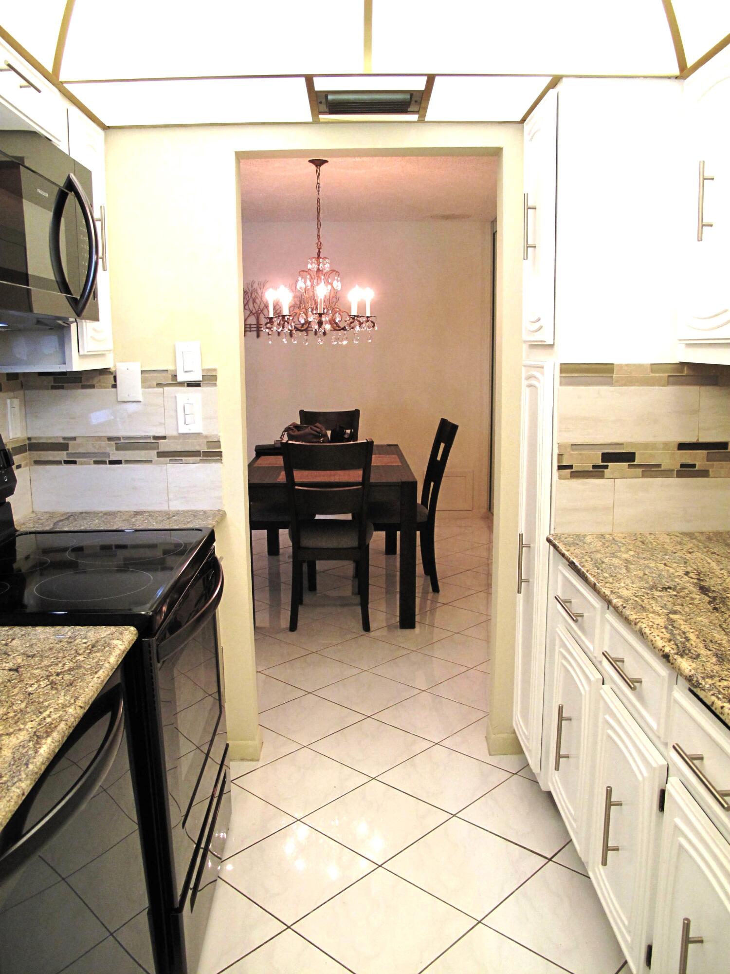 1202 South Drive Circle, Unit B Delray Beach, FL 33445 - Photo 20 of 57 New Black SS appliances with new garnite