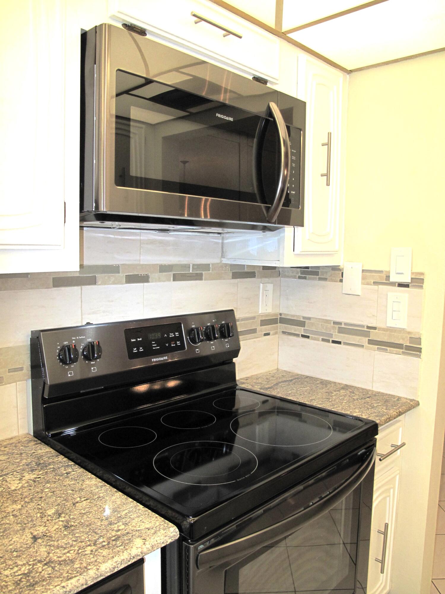 1202 South Drive Circle, Unit B Delray Beach, FL 33445 - Photo 21 of 57 New Black SS appliances with new garnite