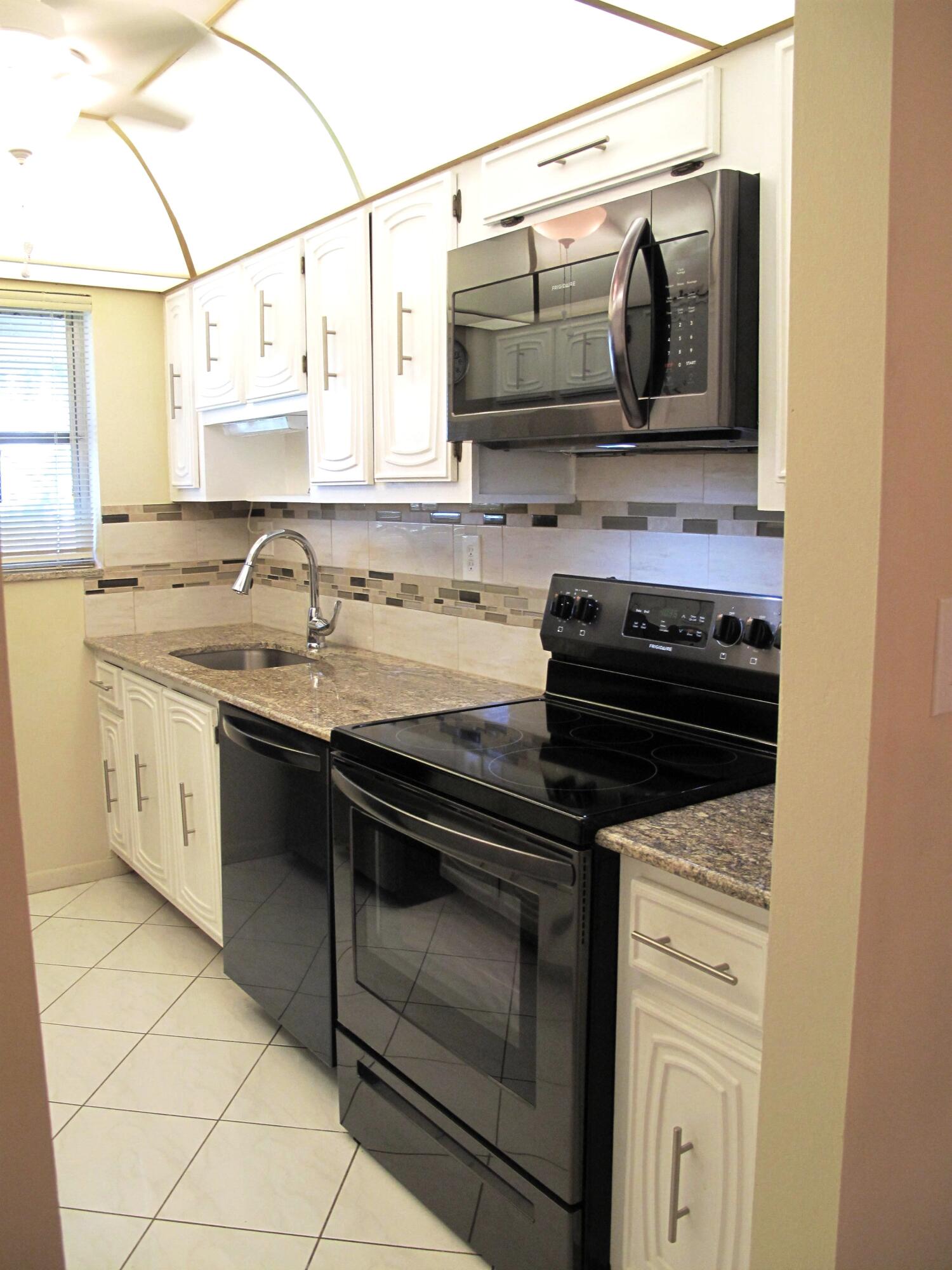 1202 South Drive Circle, Unit B Delray Beach, FL 33445 - Photo 22 of 57 New Black SS appliances with new garnite