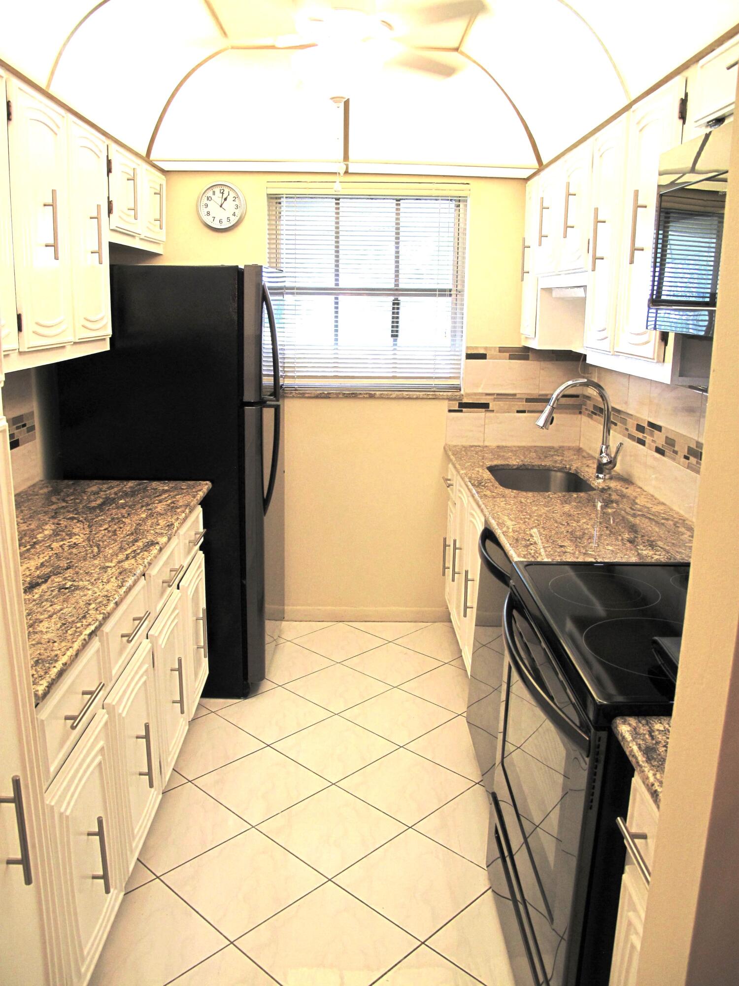 1202 South Drive Circle, Unit B Delray Beach, FL 33445 - Photo 24 of 57 Remodeled kitchen wtih granite counters