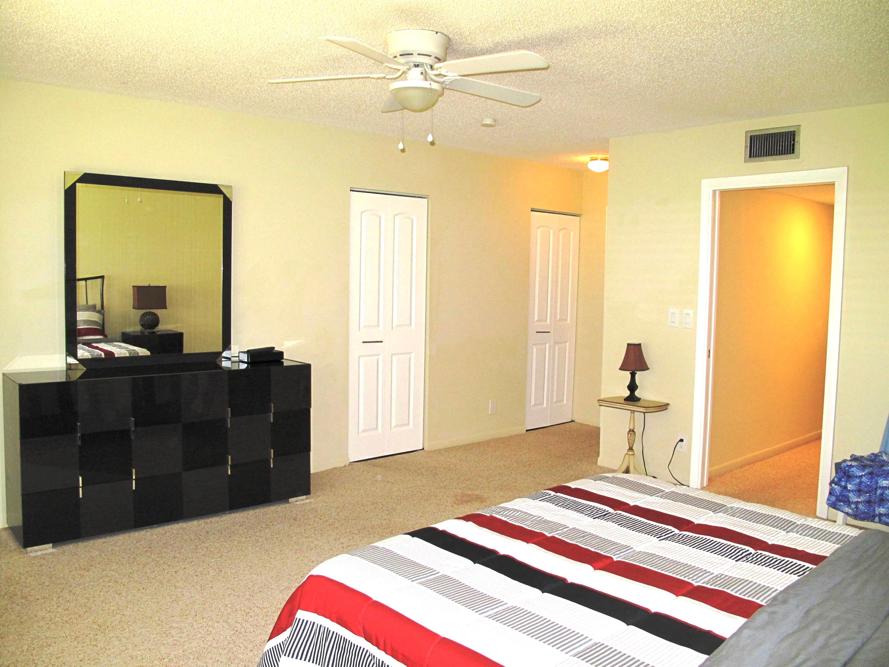 1202 South Drive Circle, Unit B Delray Beach, FL 33445 - Photo 28 of 57 Spacious master bedroom with 2 huge clos