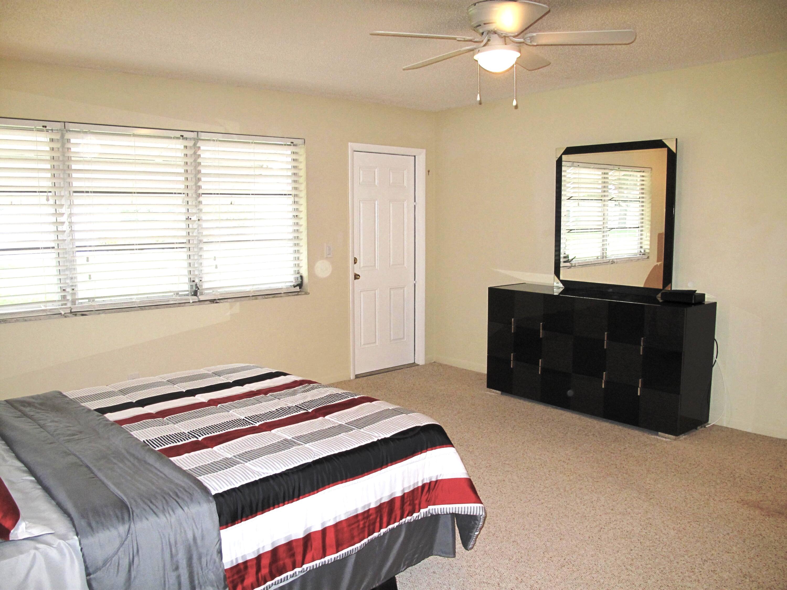 1202 South Drive Circle, Unit B Delray Beach, FL 33445 - Photo 30 of 57 Spacious master bedroom with 2 huge clos