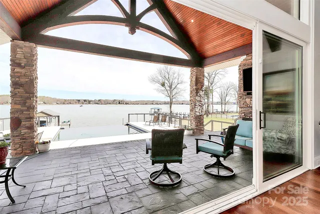 a view of a living room and floor to ceiling window or couch