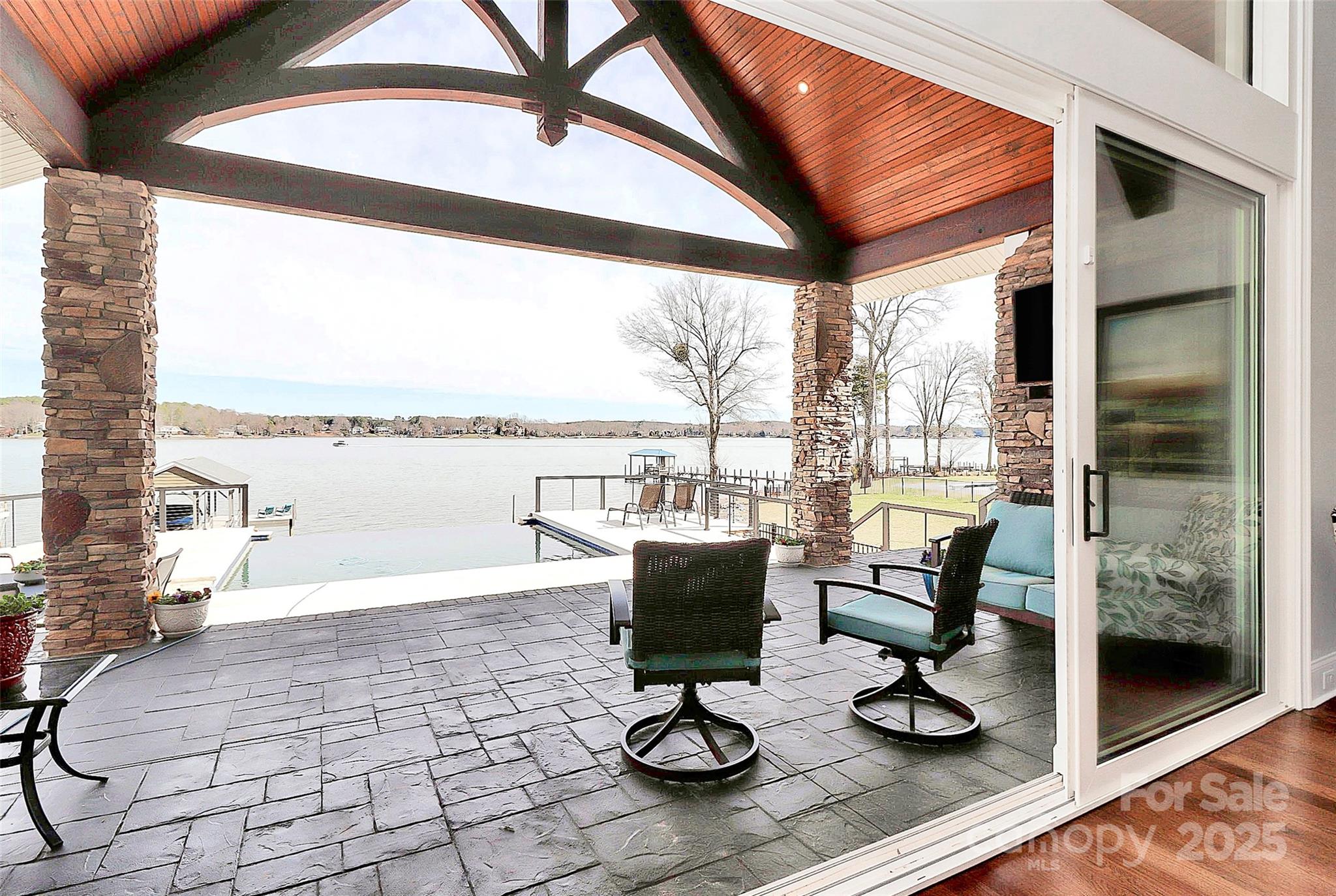 a view of a living room and floor to ceiling window or couch