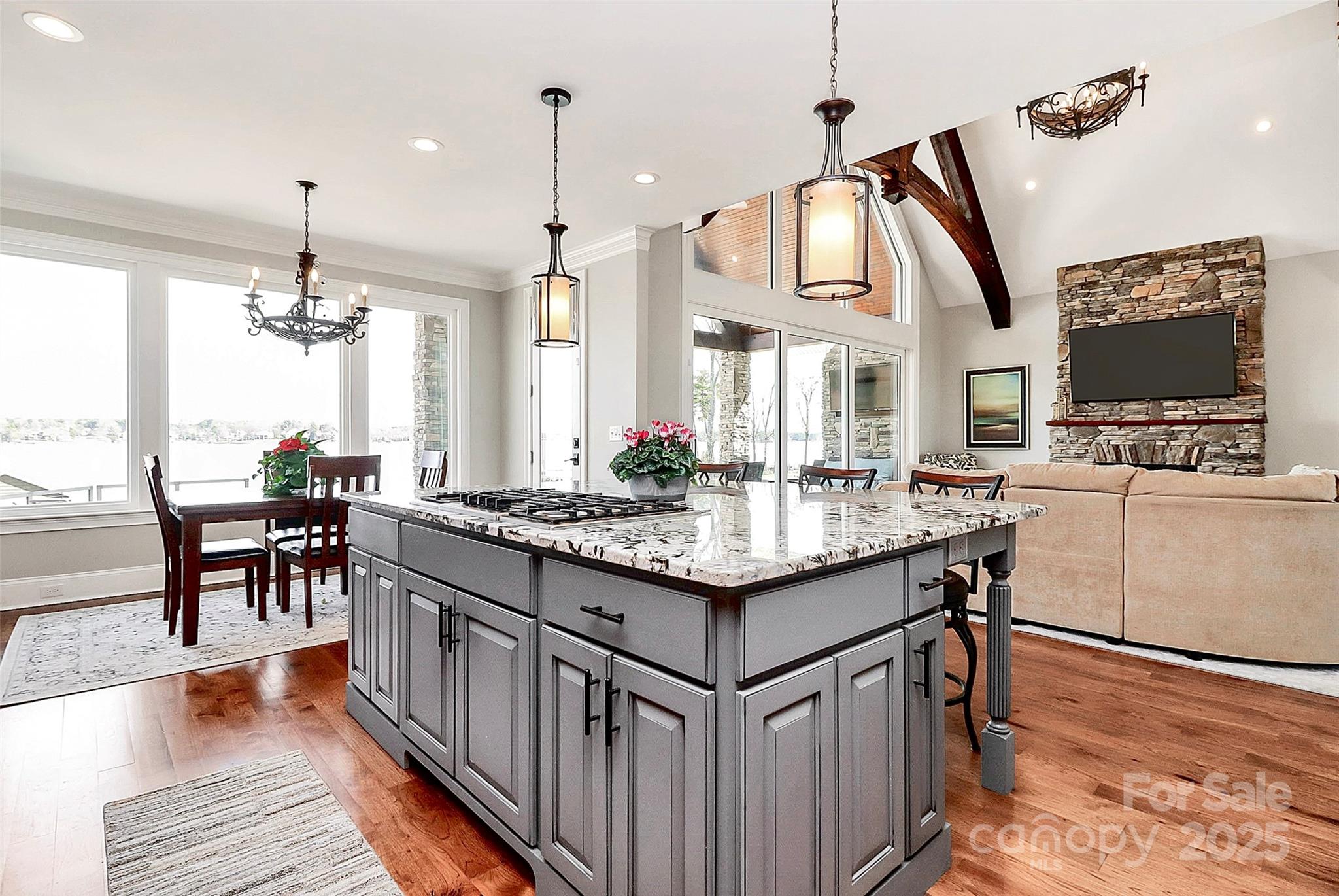 5086 Windward Point Lane Denver, NC 28037 - Photo 13 of 36 a kitchen with granite countertop a stove and a wooden floor
