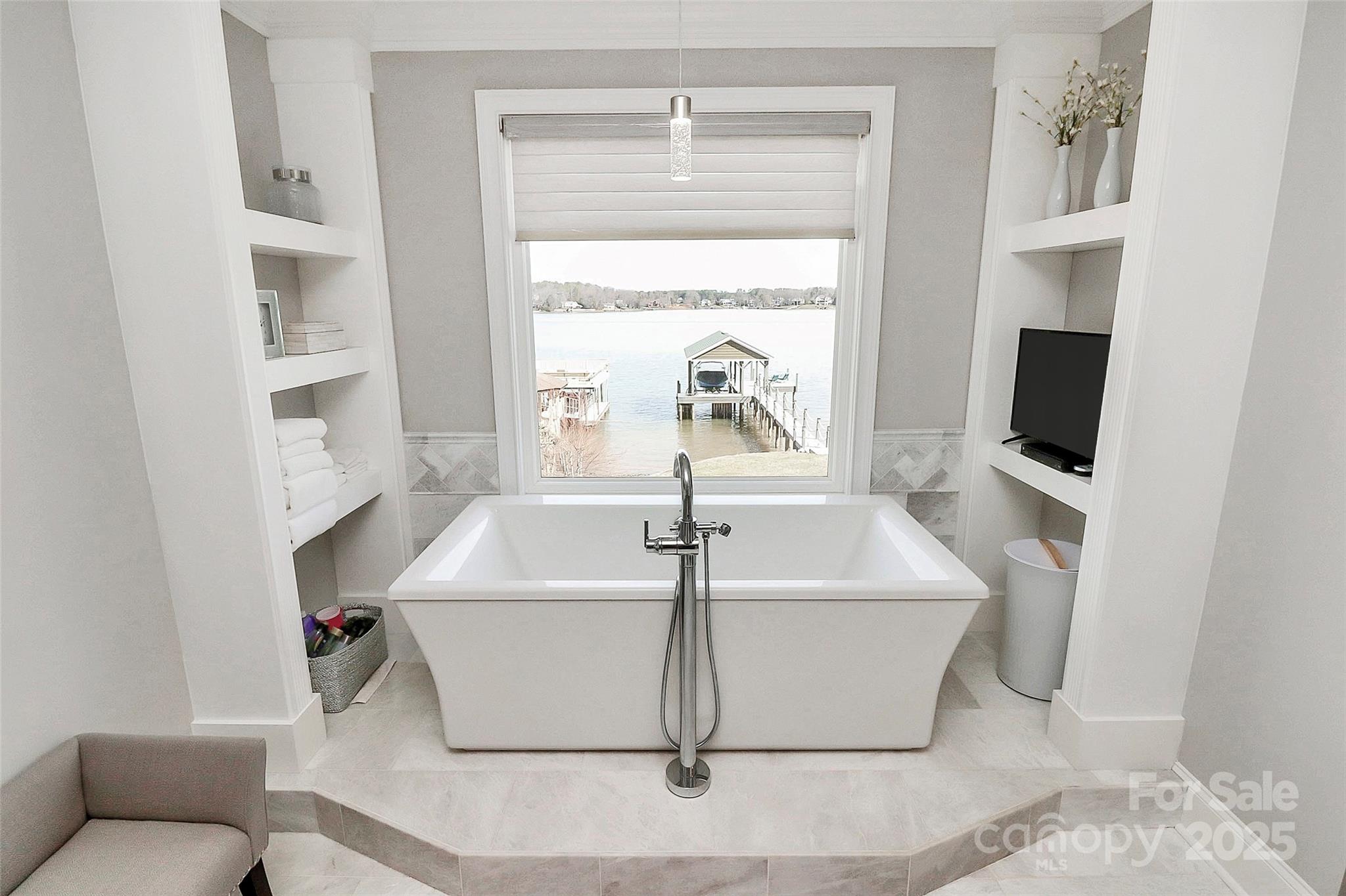 5086 Windward Point Lane Denver, NC 28037 - Photo 20 of 36 a floor with a sink and a flat screen tv