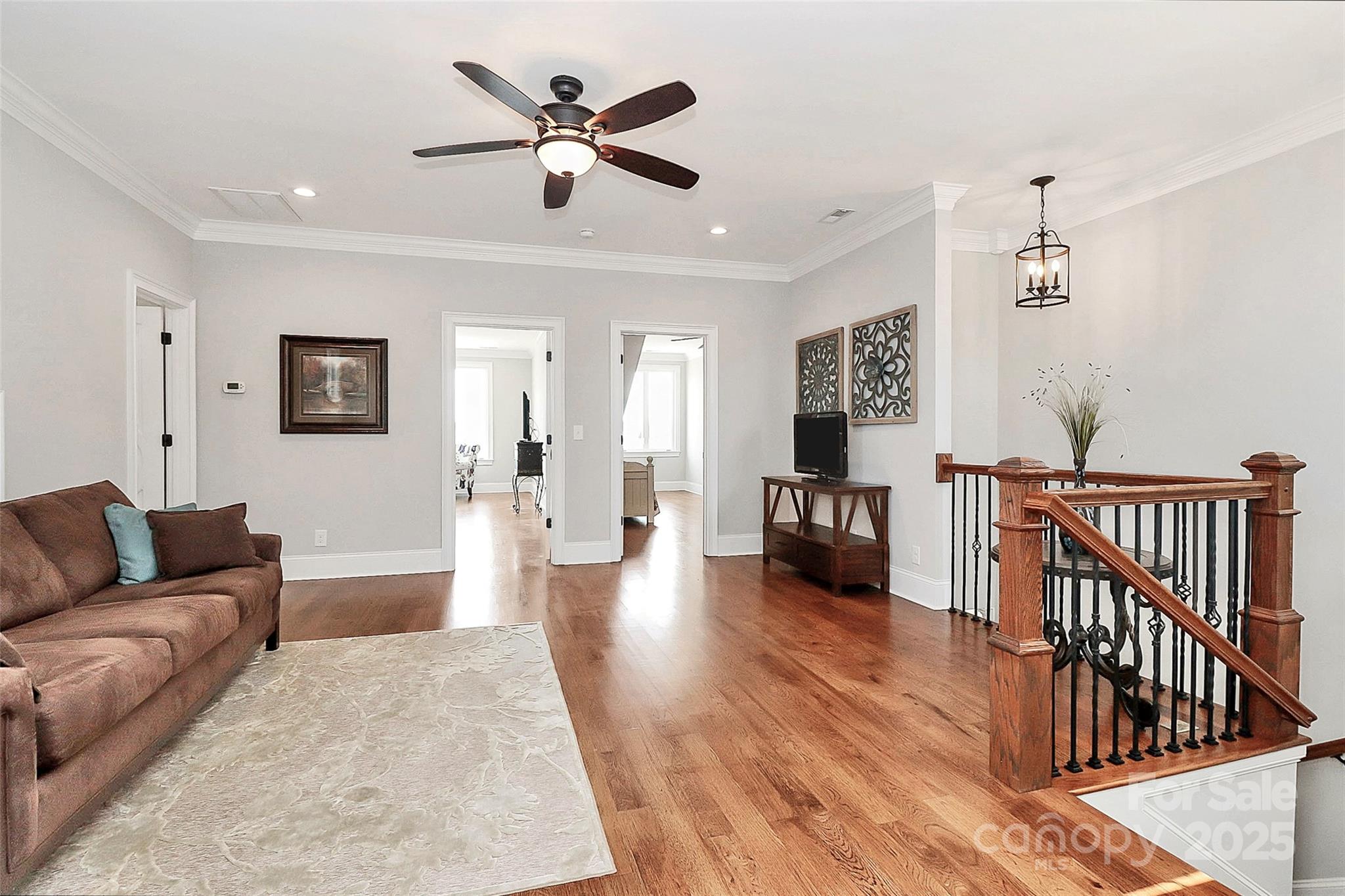 5086 Windward Point Lane Denver, NC 28037 - Photo 23 of 36 a living room with furniture and a wooden floor