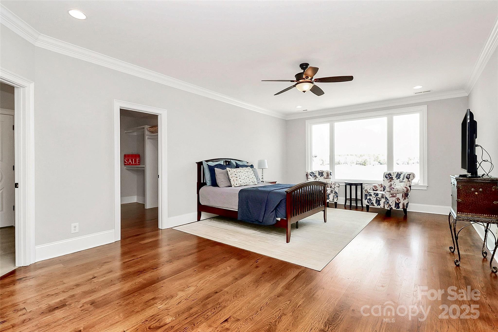 5086 Windward Point Lane Denver, NC 28037 - Photo 24 of 36 a bedroom with furniture and a large window