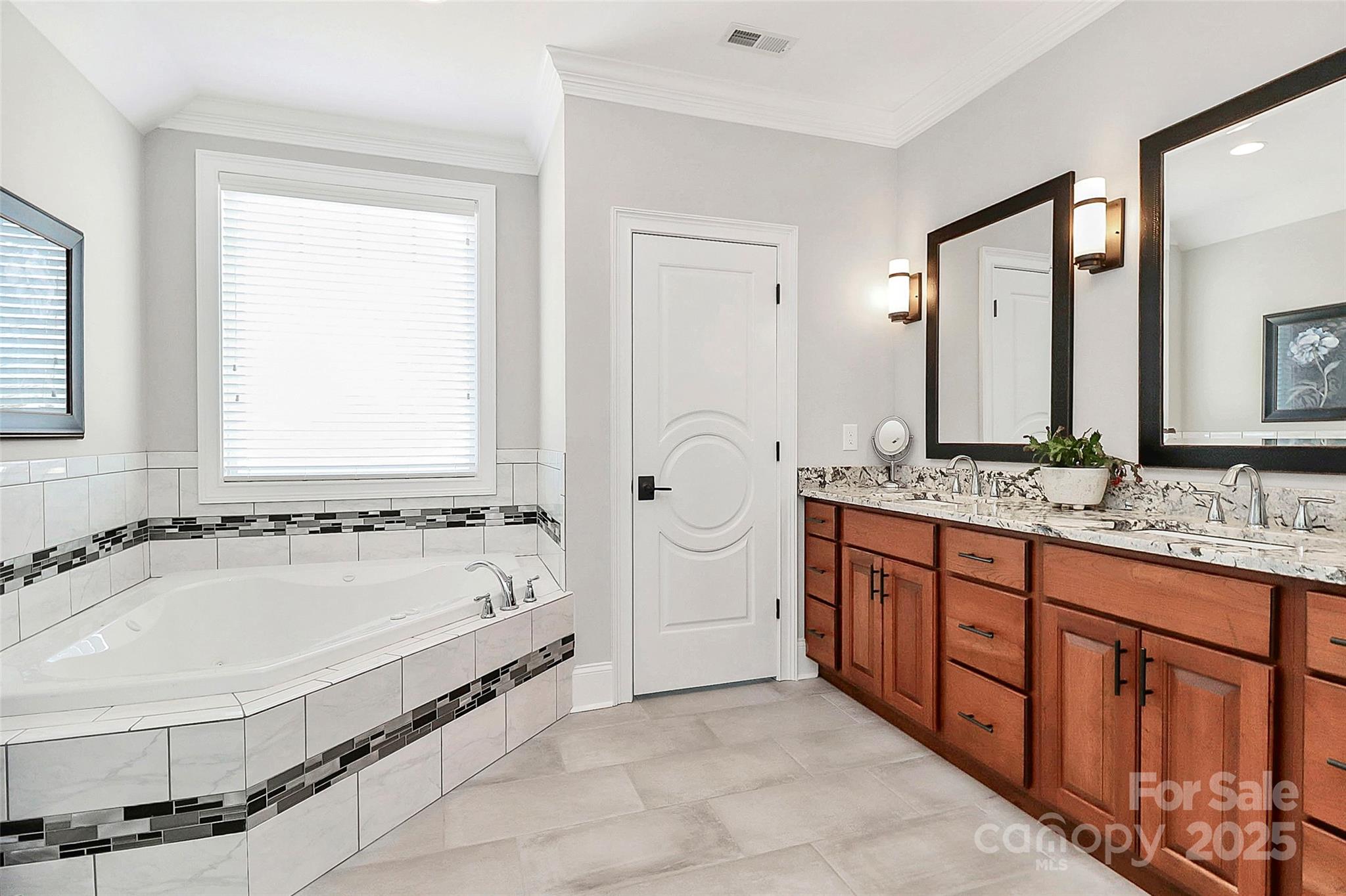 5086 Windward Point Lane Denver, NC 28037 - Photo 25 of 36 a spacious bathroom with bathtub shower and a sink