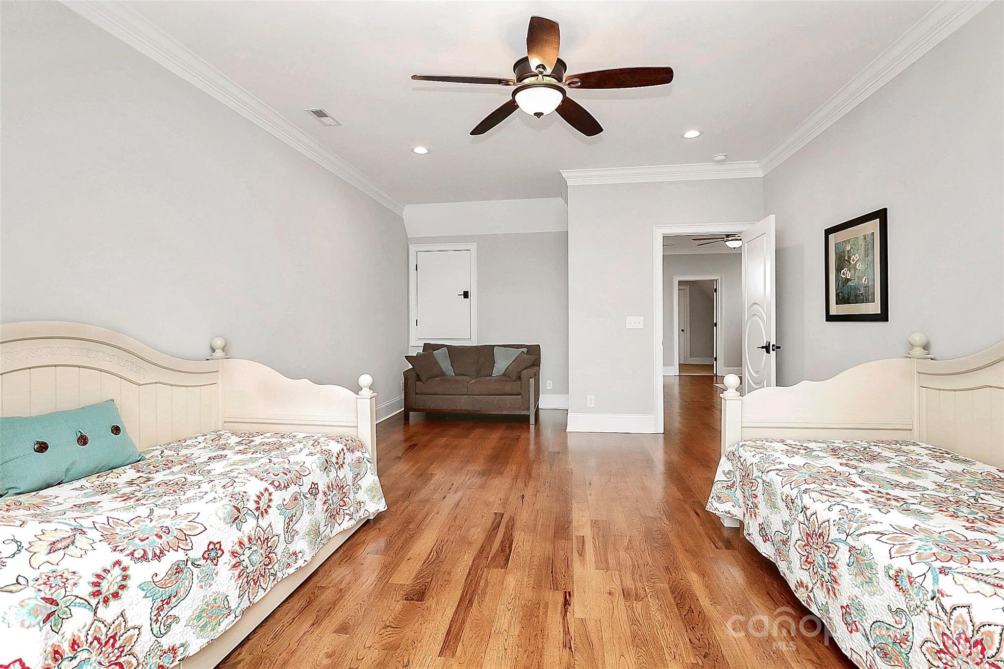 5086 Windward Point Lane Denver, NC 28037 - Photo 26 of 36 a bedroom with a bed and wooden floor