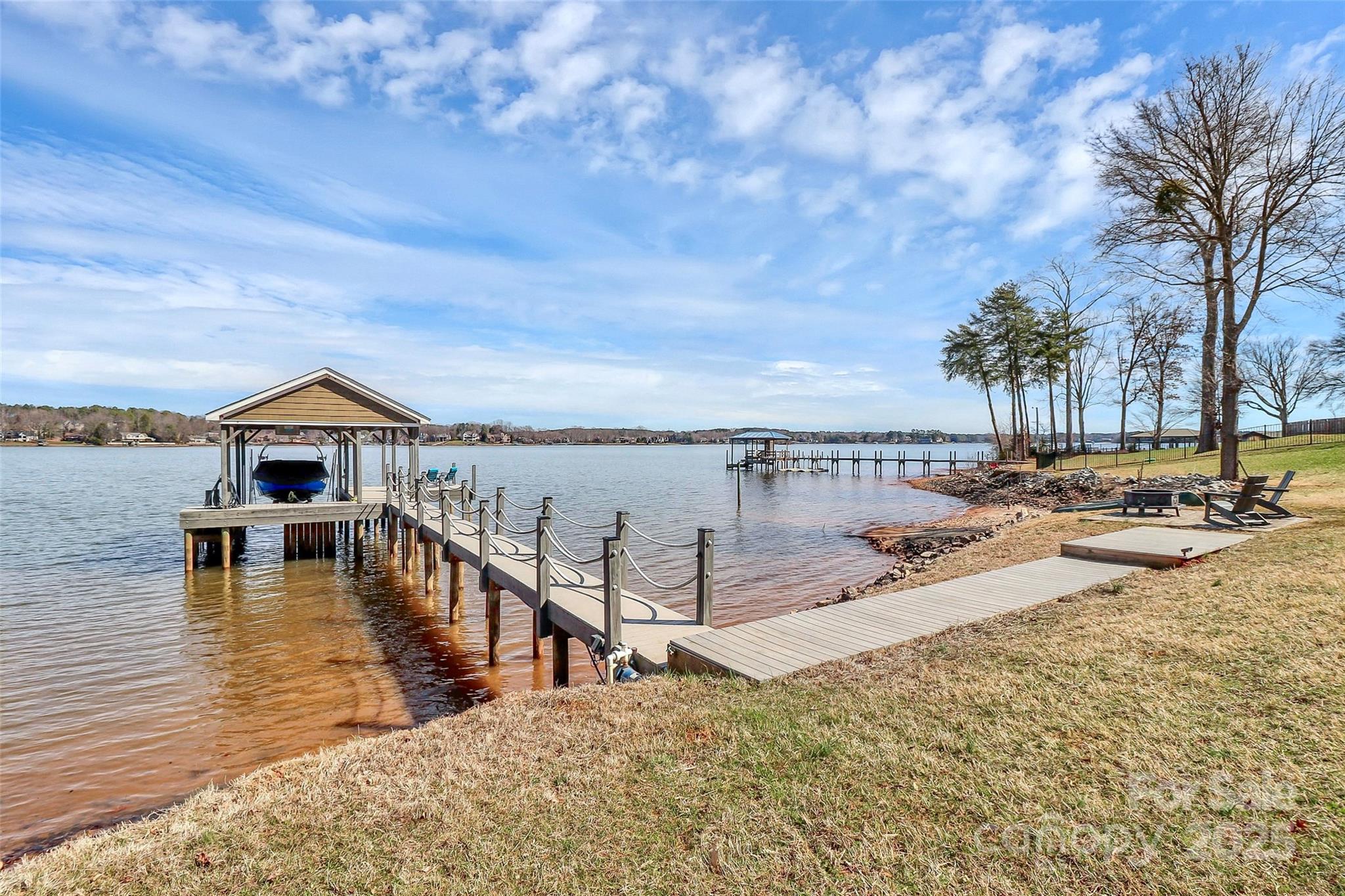 5086 Windward Point Lane Denver, NC 28037 - Photo 34 of 36 a view of a house with swimming pool and sitting area