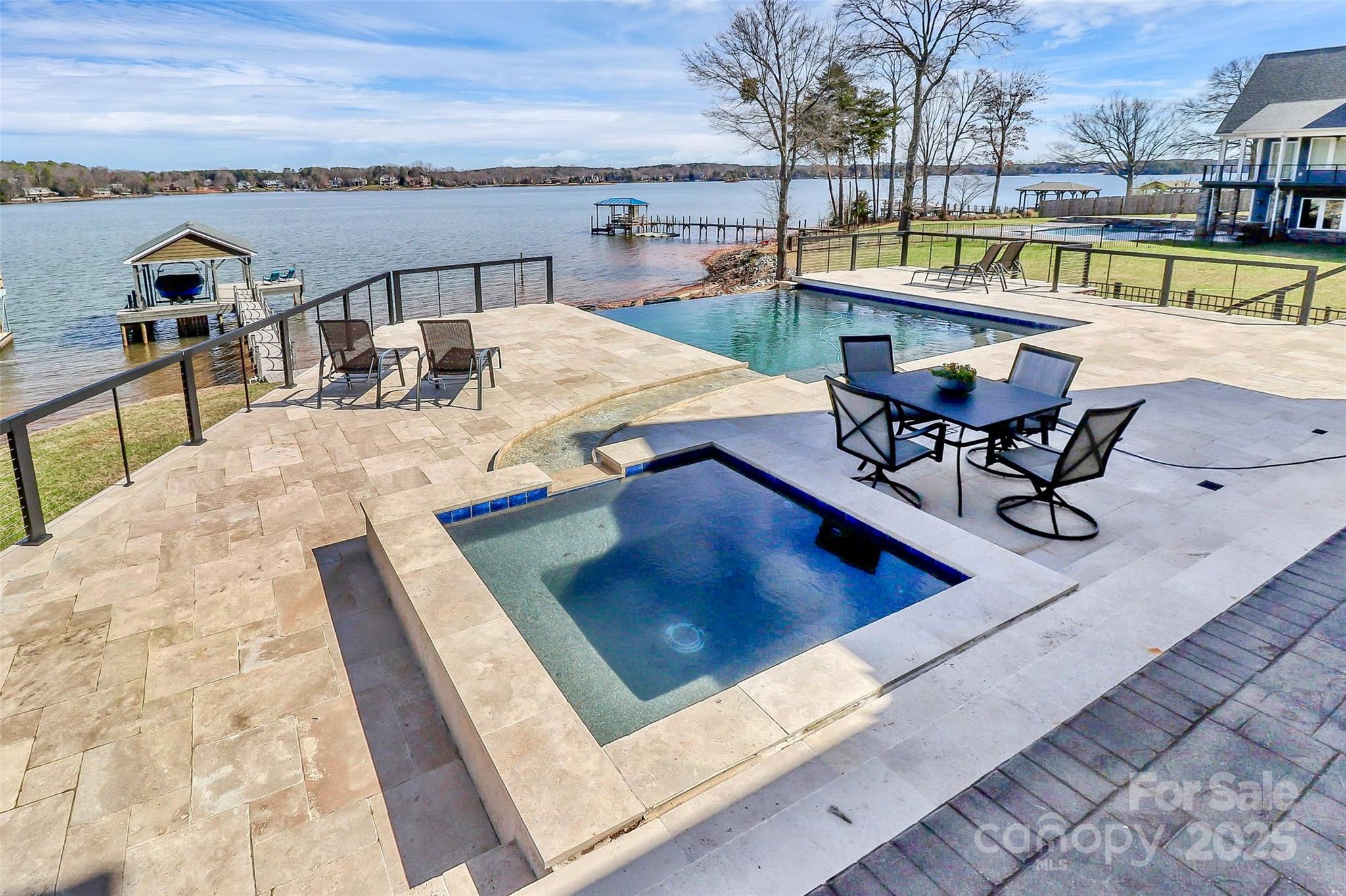 5086 Windward Point Lane Denver, NC 28037 - Photo 7 of 36 a view of a swimming pool with a lounge chair