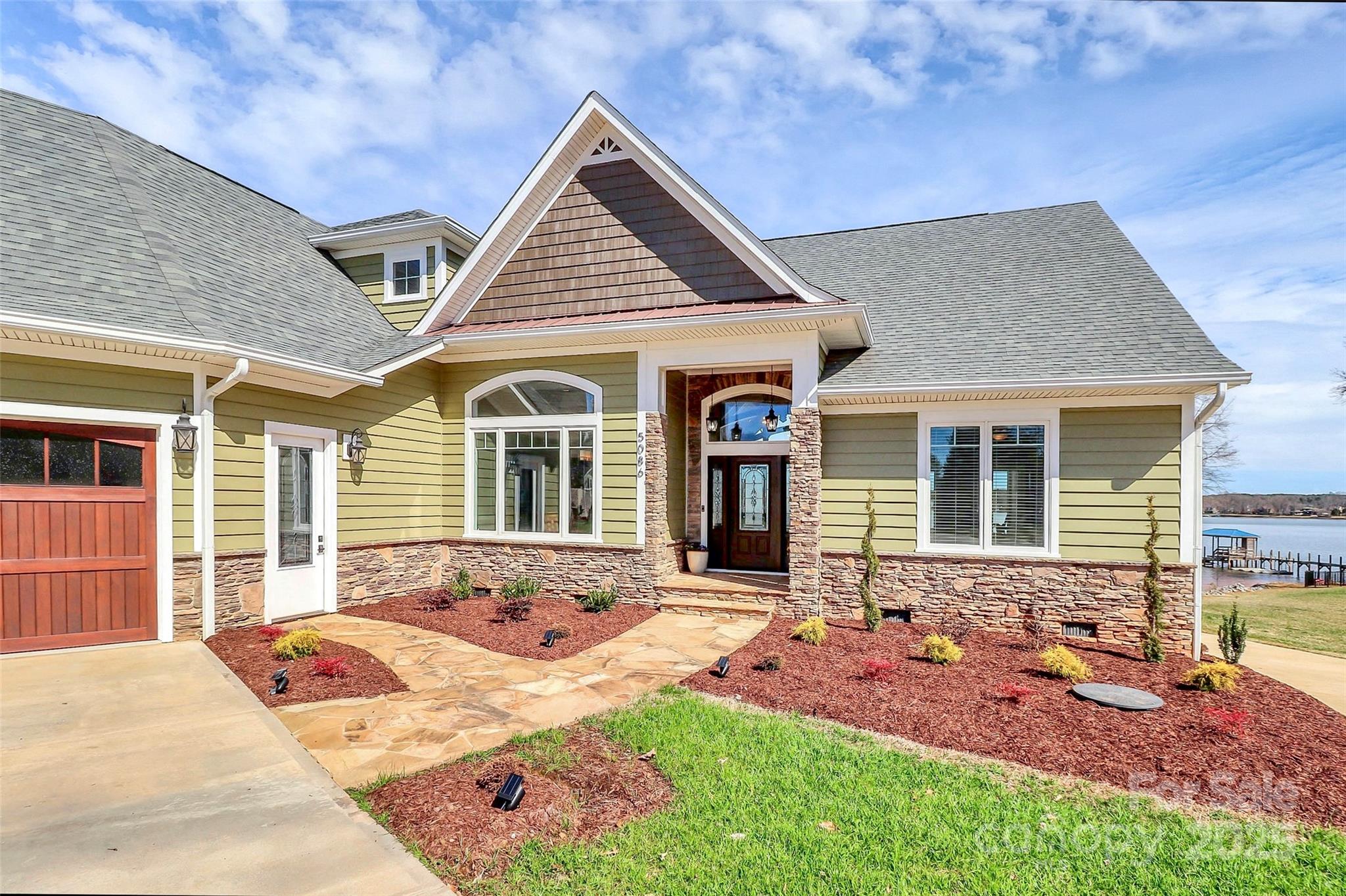 5086 Windward Point Lane Denver, NC 28037 - Photo 10 of 36 a front view of a house with a yard outdoor seating and barbeque oven
