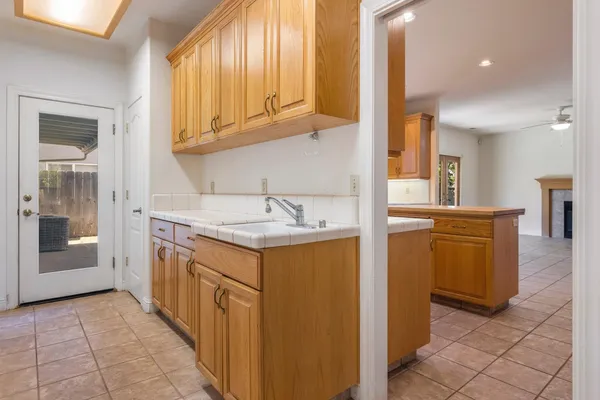 a kitchen with cabinets a sink and a stove