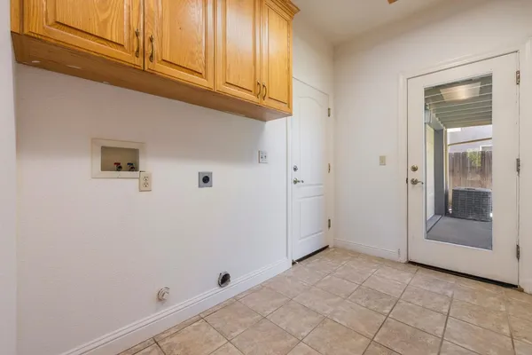 a kitchen with stainless steel appliances granite countertop a sink counter space cabinets and a large window