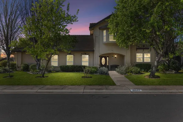front view of a house with a yard