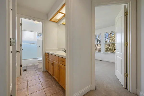 a view of a bathroom from a hallway with toilet