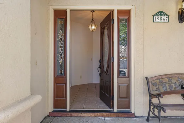 a view of an entryway with a window and a bathroom