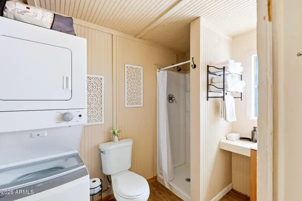 a white toilet sitting next to a bathroom sink
