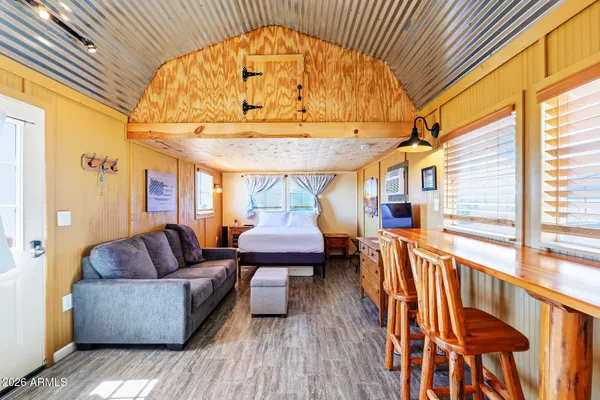 a living room filled with furniture and a table