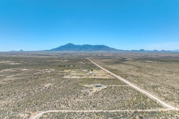 a view of an ocean with a mountain
