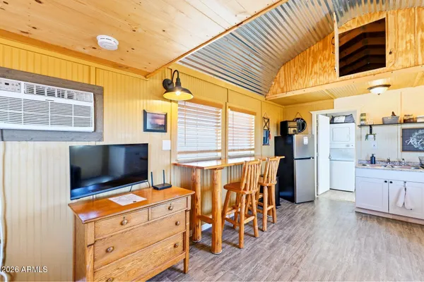 a room with furniture and flat screen tv