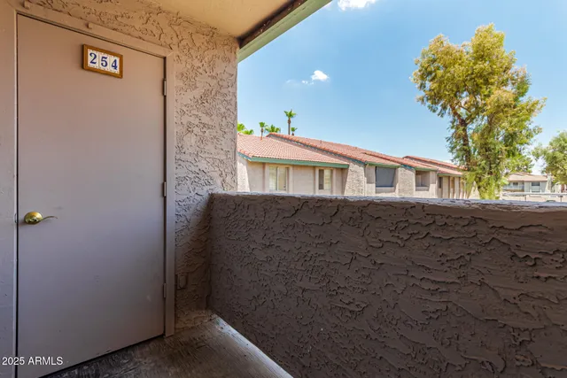 a view of a house with a tree