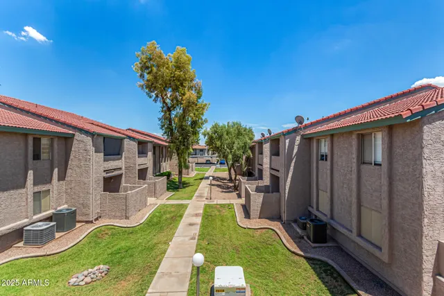 a backyard of a house with seating space